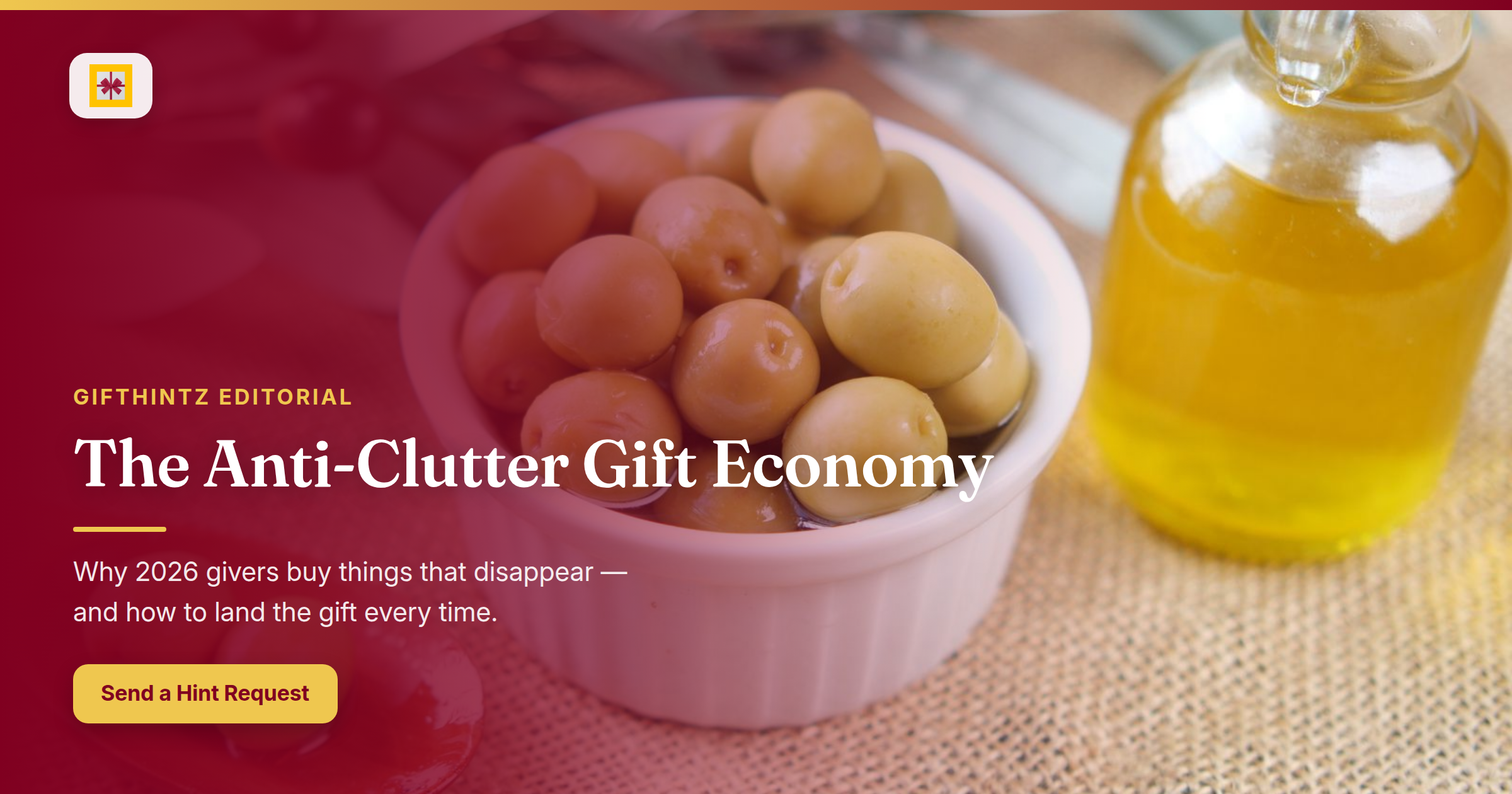 Editorial hero banner: fresh green olives in a bowl beside a bottle of olive oil on a textured surface, with the title 'The Anti-Clutter Gift Economy' overlaid
